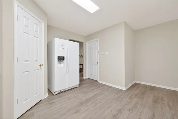 an empty room with wooden floor