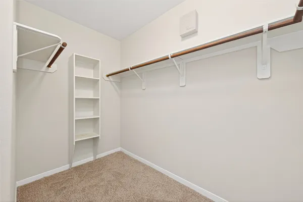 a view of an empty walk in closet