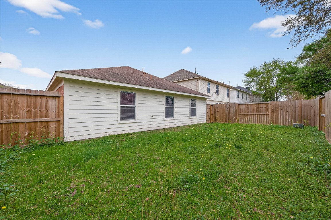 22603 Spring Crossing Drive Spring, TX 77373 - Photo 26 of 29 a view of a house with a yard