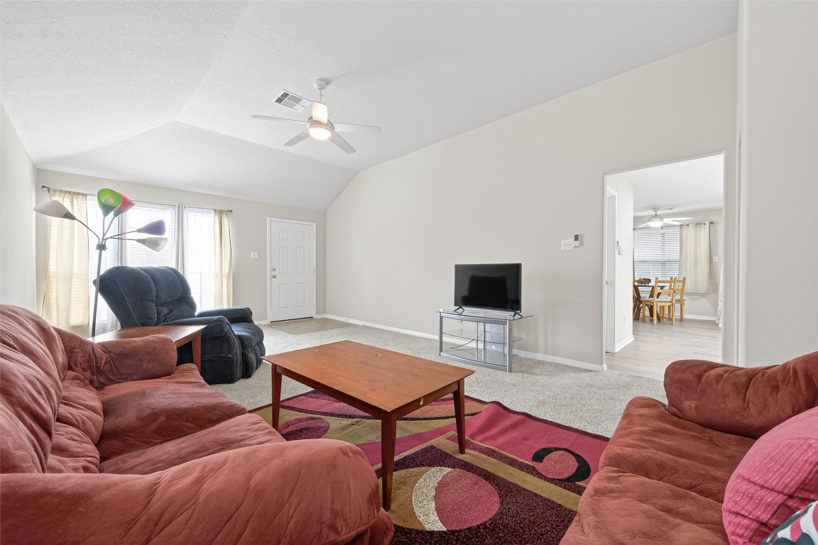 22603 Spring Crossing Drive Spring, TX 77373 - Photo 5 of 29 a living room with furniture and a flat screen tv