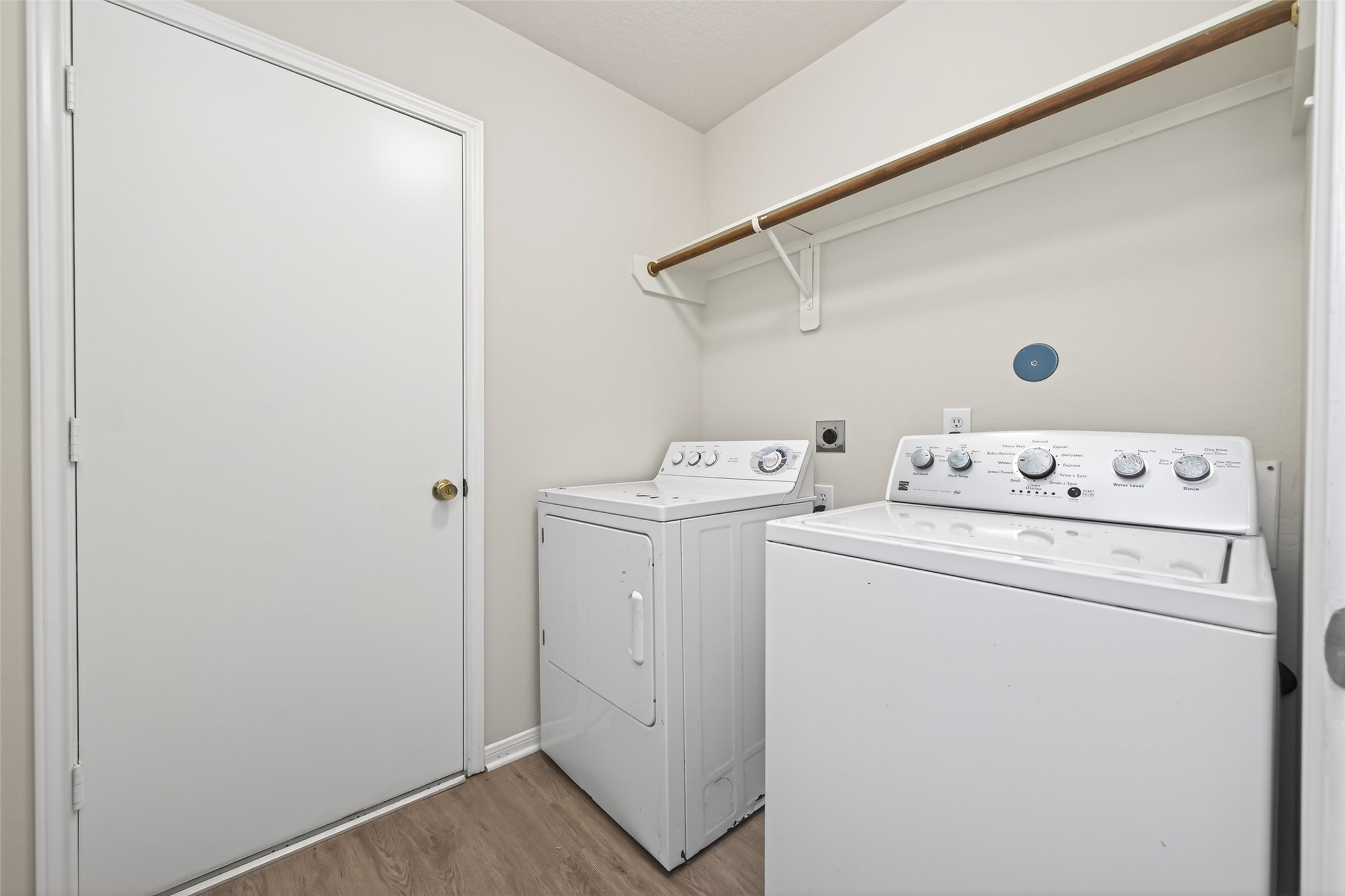 22603 Spring Crossing Drive Spring, TX 77373 - Photo 9 of 22 a view of washer and dryer with bathroom in the background