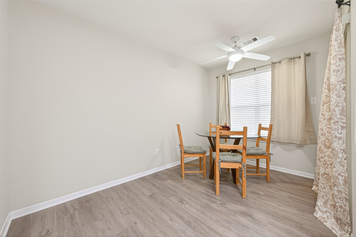 22603 Spring Crossing Drive Spring, TX 77373 - Photo 9 of 29 a dining room with furniture and wooden floor