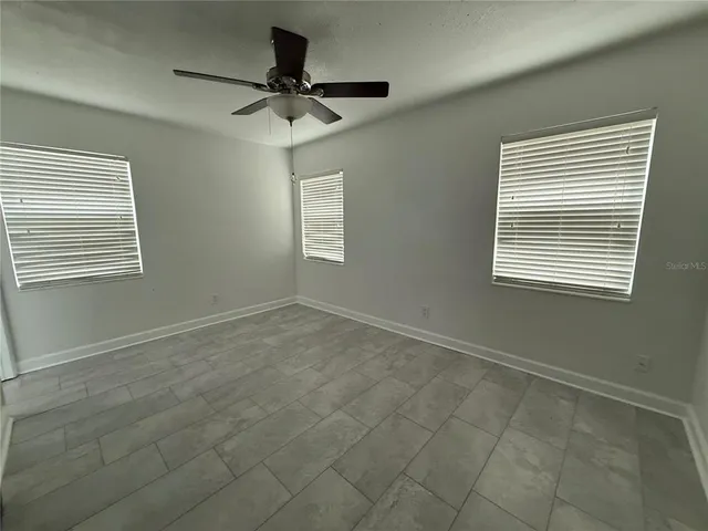 a view of an empty room with a window