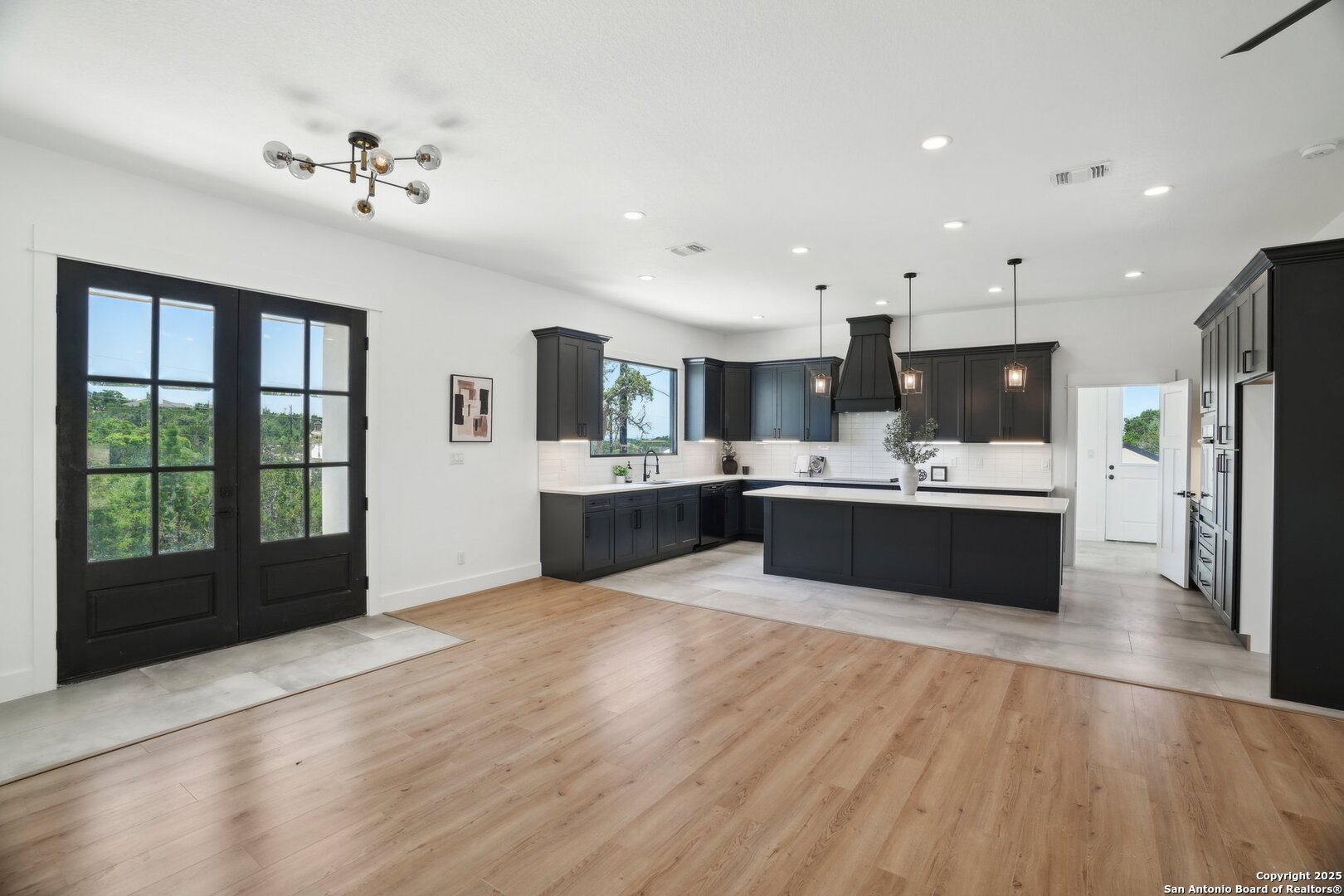 166 Magnolia Meadow Spring Branch, TX 78070 - Photo 11 of 41 a large white kitchen with a large window