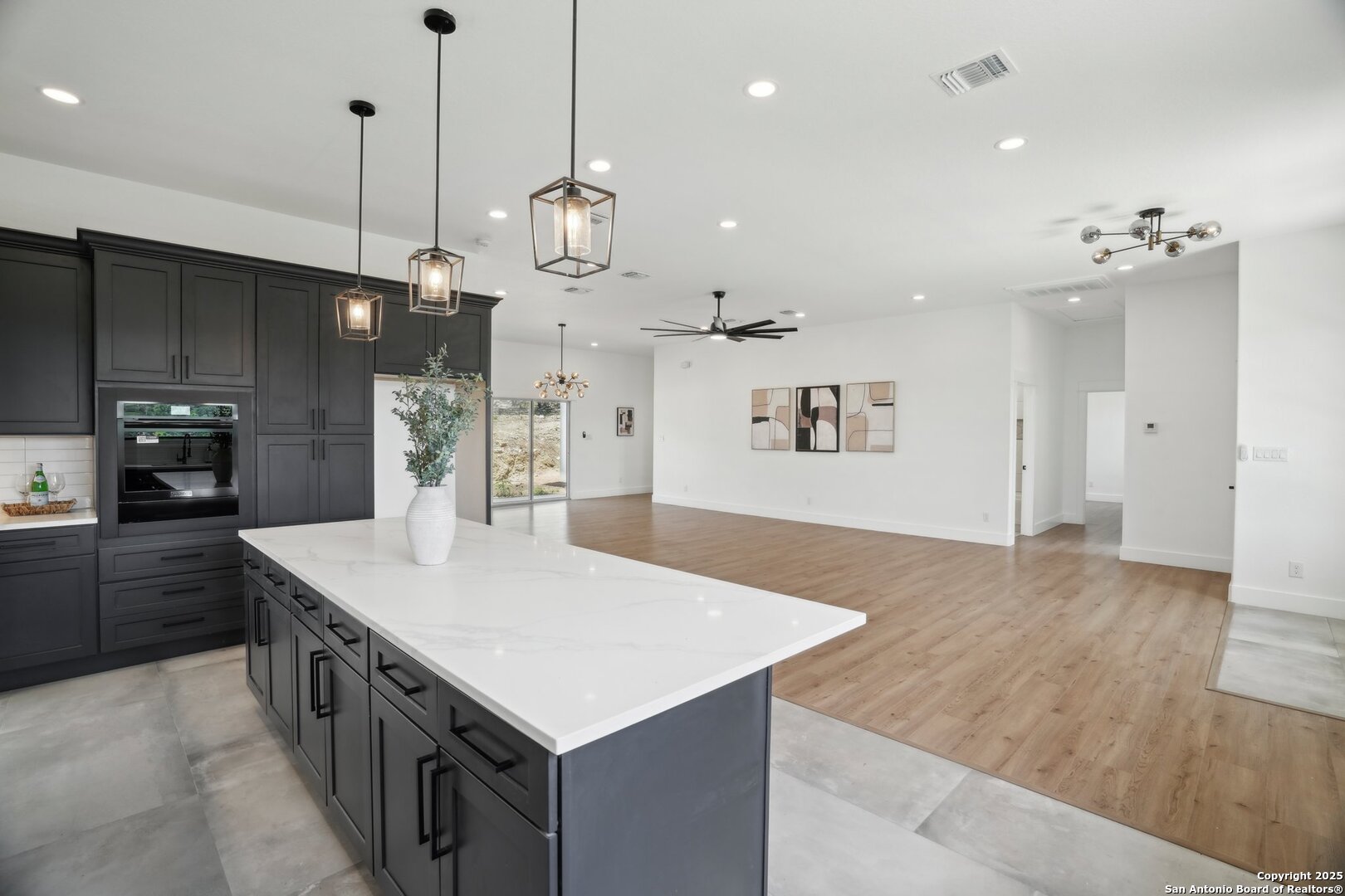 166 Magnolia Meadow Spring Branch, TX 78070 - Photo 14 of 41 a kitchen with kitchen island a sink stove and refrigerator