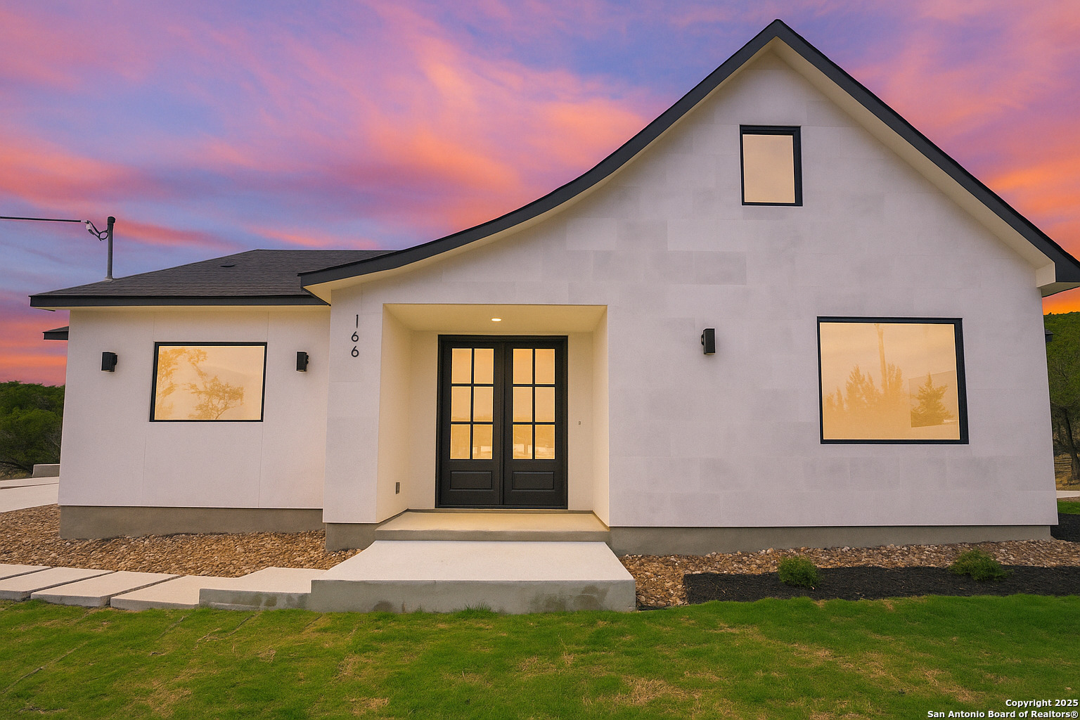 166 Magnolia Meadow Spring Branch, TX 78070 - Photo 2 of 41 a front view of a house with a yard