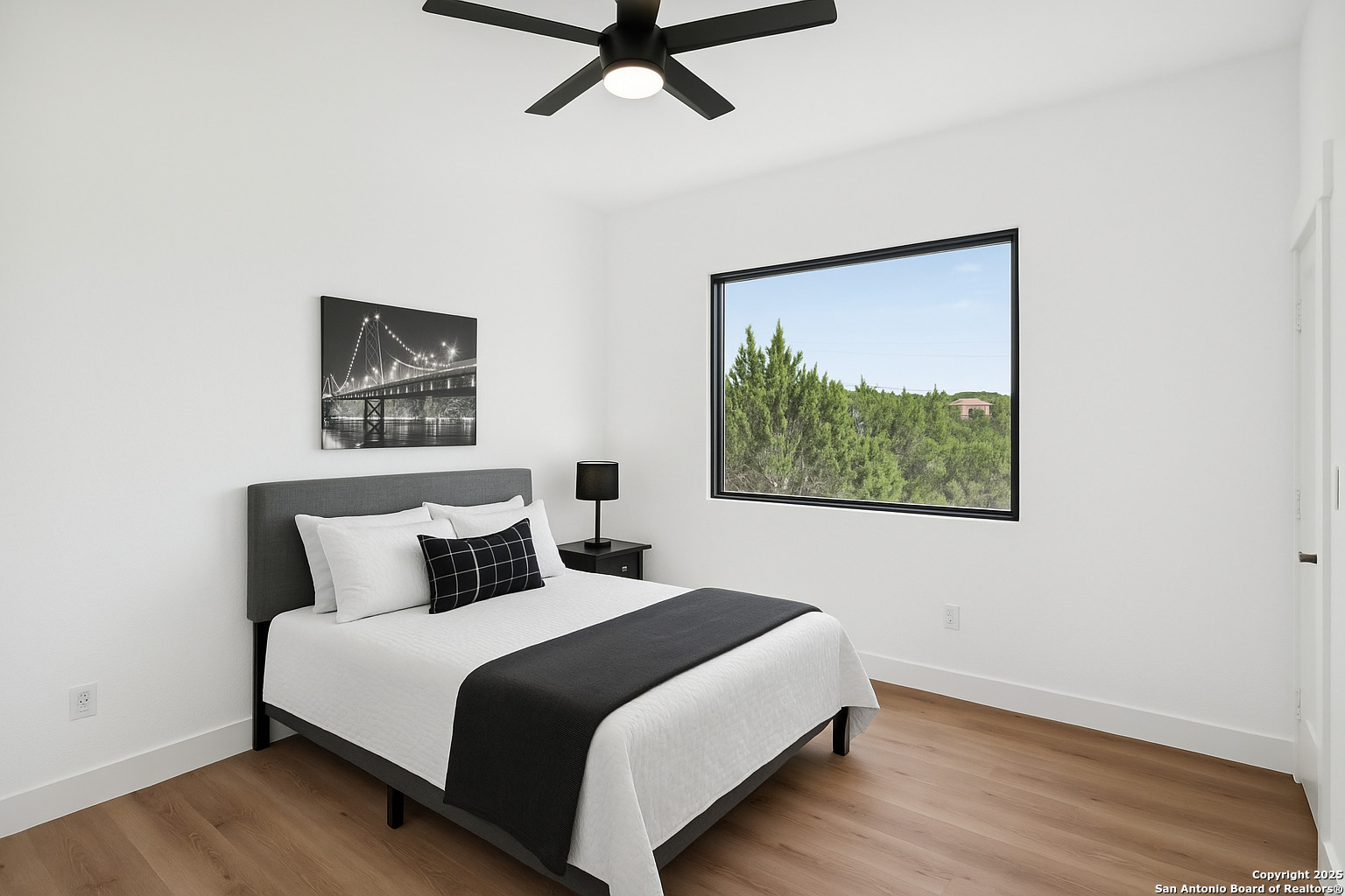 166 Magnolia Meadow Spring Branch, TX 78070 - Photo 22 of 41 a bedroom with a bed and a painting on the wall