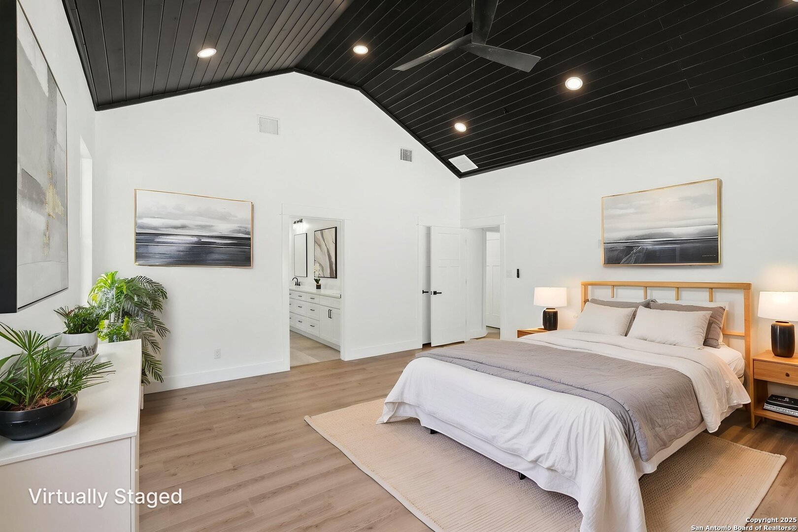 166 Magnolia Meadow Spring Branch, TX 78070 - Photo 25 of 41 a spacious bedroom with a bed and a potted plant