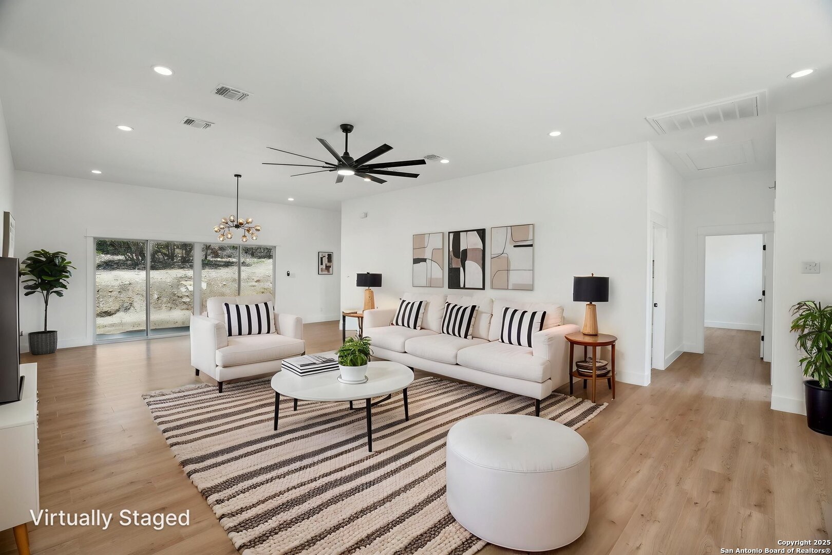 166 Magnolia Meadow Spring Branch, TX 78070 - Photo 3 of 41 a living room with furniture and a wooden floor