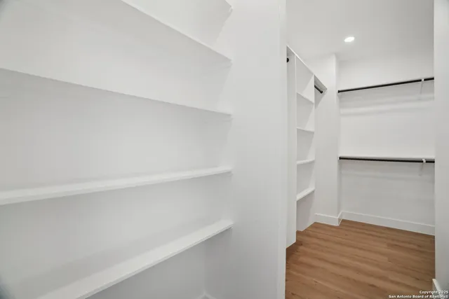 a view of an empty walk in closet