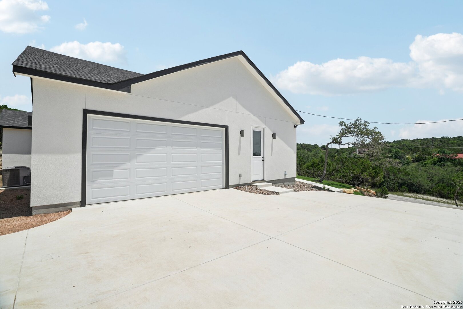 166 Magnolia Meadow Spring Branch, TX 78070 - Photo 37 of 41 a view of garage and wooden floor