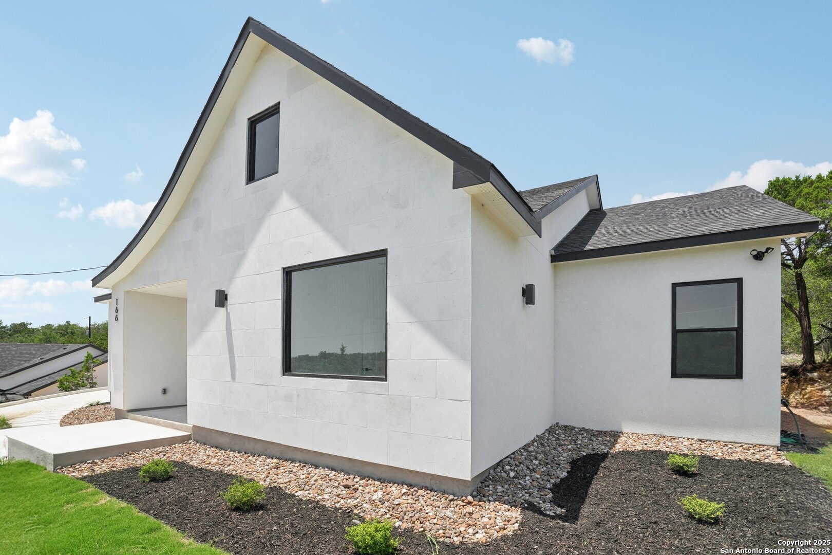 166 Magnolia Meadow Spring Branch, TX 78070 - Photo 6 of 41 a front view of a house with a yard