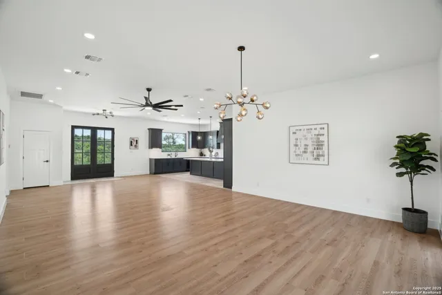 a view of a room with a kitchen and stove