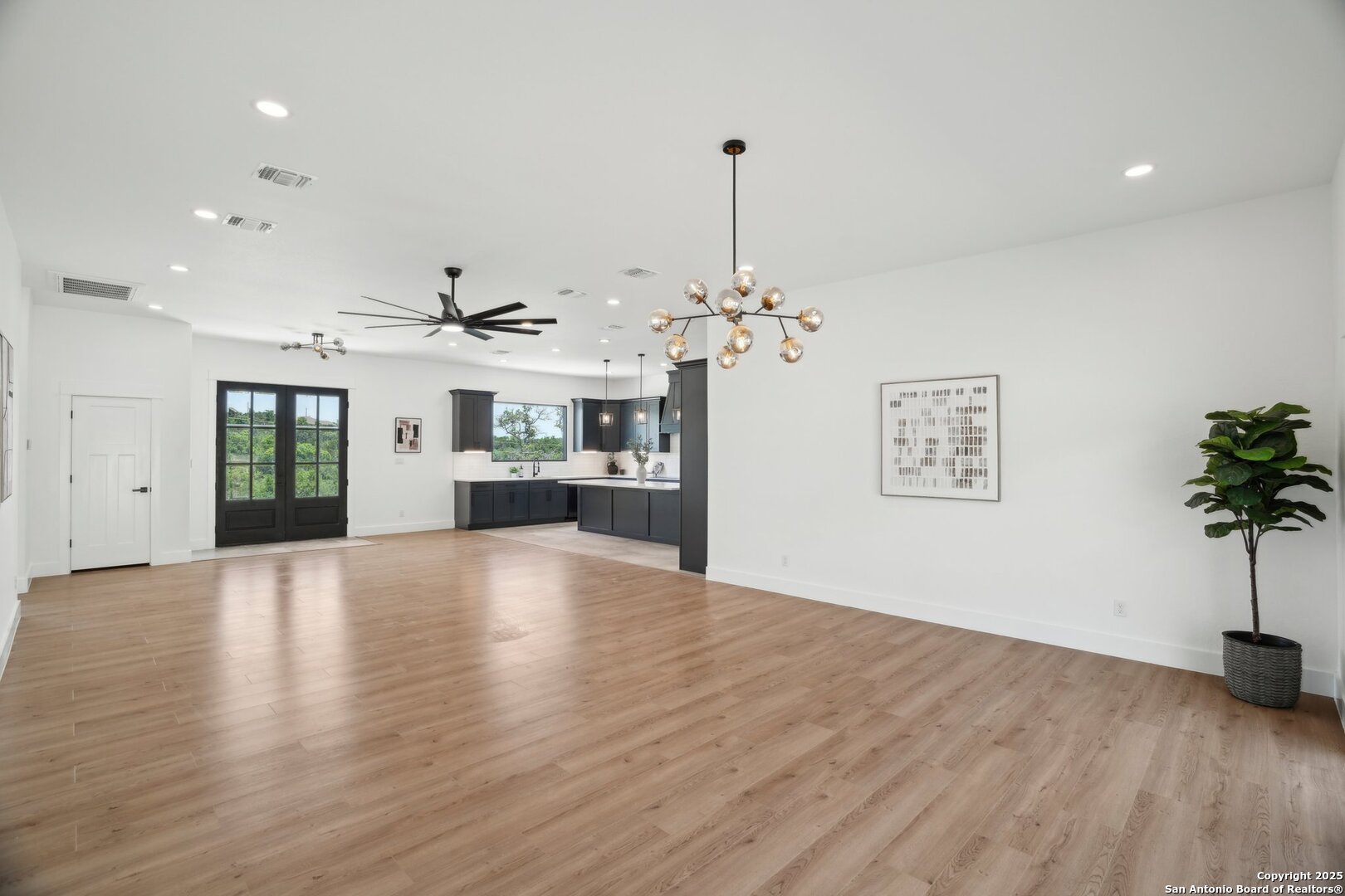 166 Magnolia Meadow Spring Branch, TX 78070 - Photo 10 of 41 a view of a room with a kitchen and stove