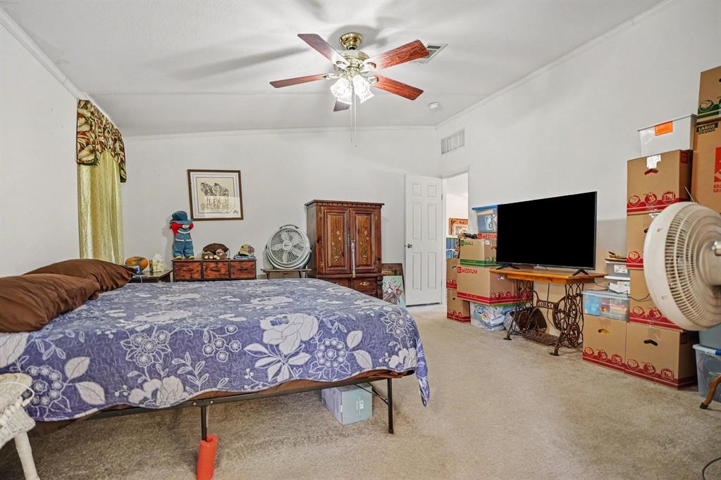 220 Barker Road Ennis, TX 75119 - Photo 16 of 30 Spacious room featuring neutral carpet flooring and white walls
