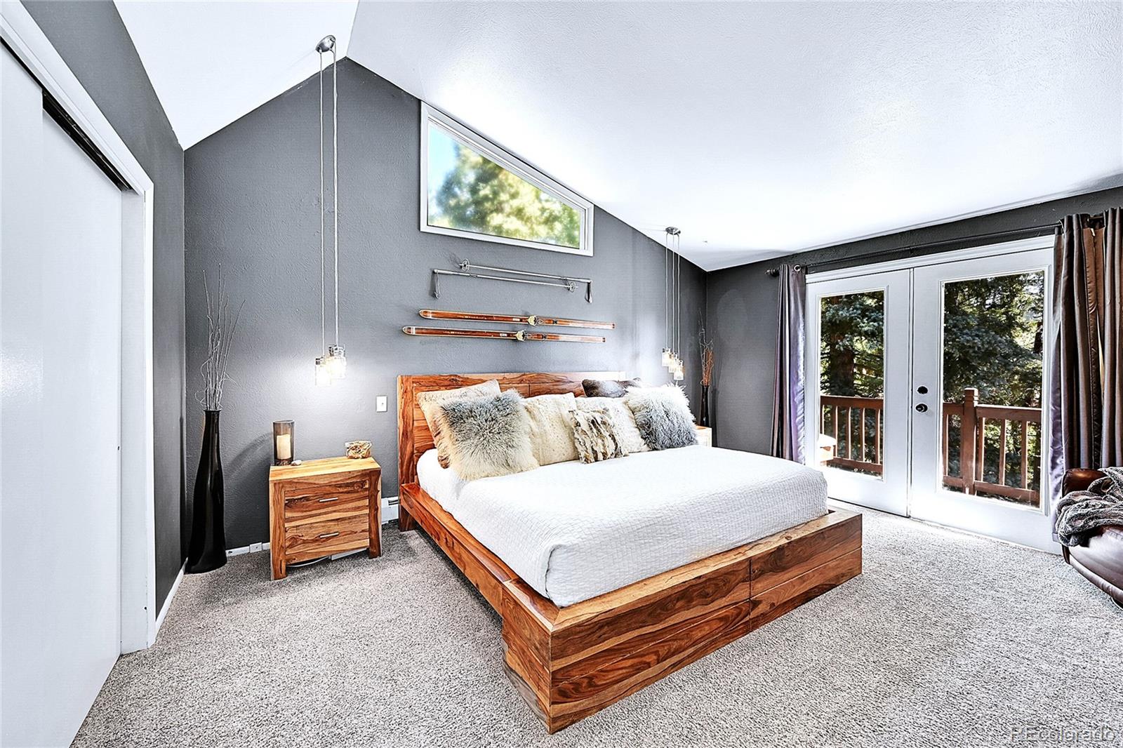 30997 Witteman Road Conifer, CO 80433 - Photo 16 of 39 a bedroom with a bed and a large window