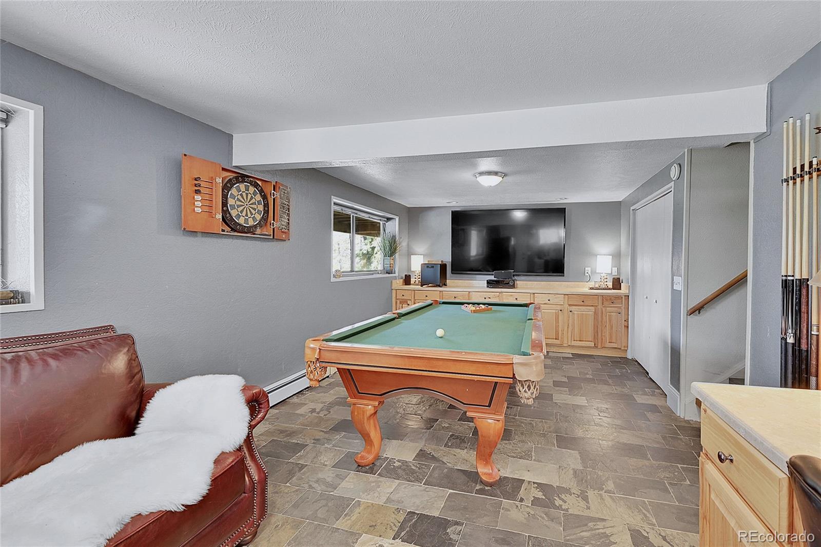 30997 Witteman Road Conifer, CO 80433 - Photo 25 of 39 a room with furniture and view kitchen