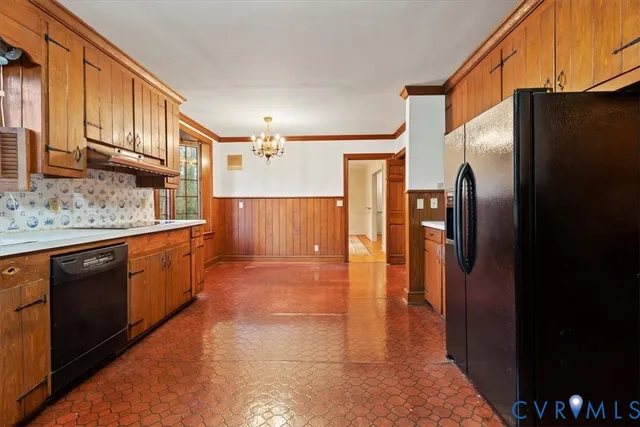 a large room with a bed and wooden floor