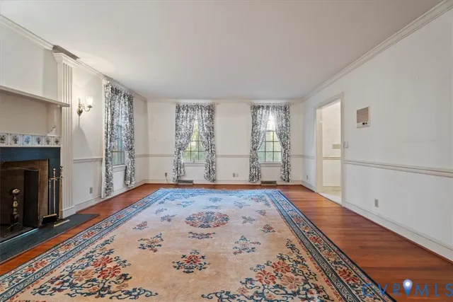 a bathroom with a granite countertop sink a toilet a mirror and shower