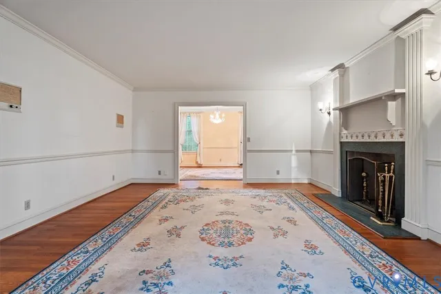 a view of entryway livingroom and hall with wooden floor