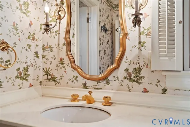 an aerial view of residential house with outdoor space and trees all around