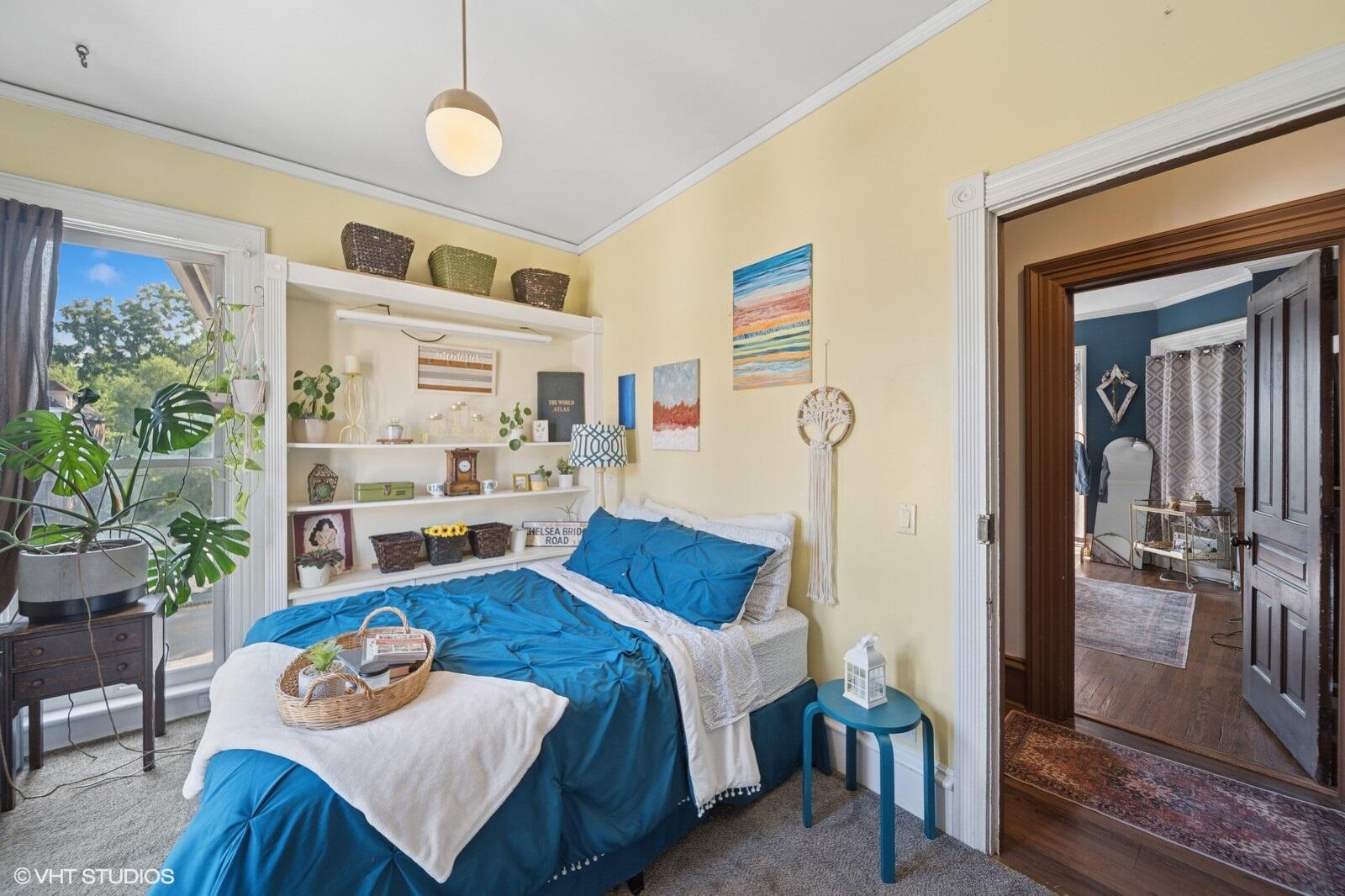717 Pine Street Michigan City, IN 46360 - Photo 11 of 20 a bedroom with furniture and a window