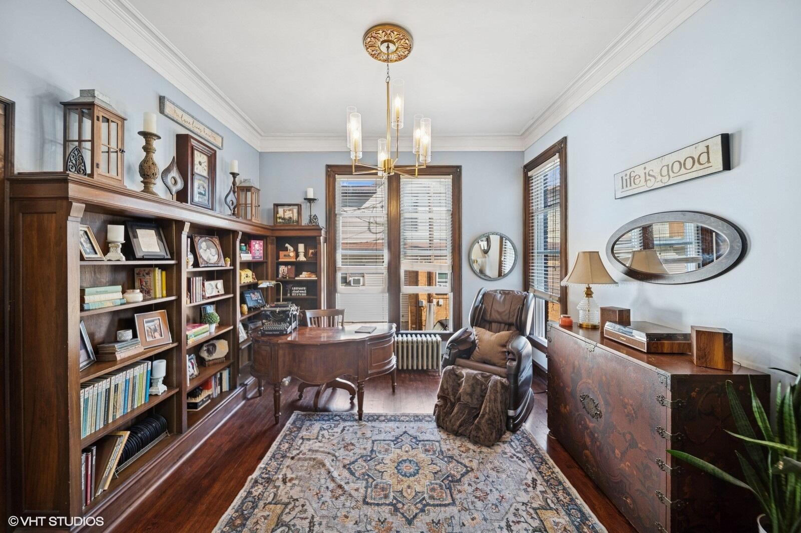 717 Pine Street Michigan City, IN 46360 - Photo 5 of 20 a living room with fireplace furniture and a book shelf