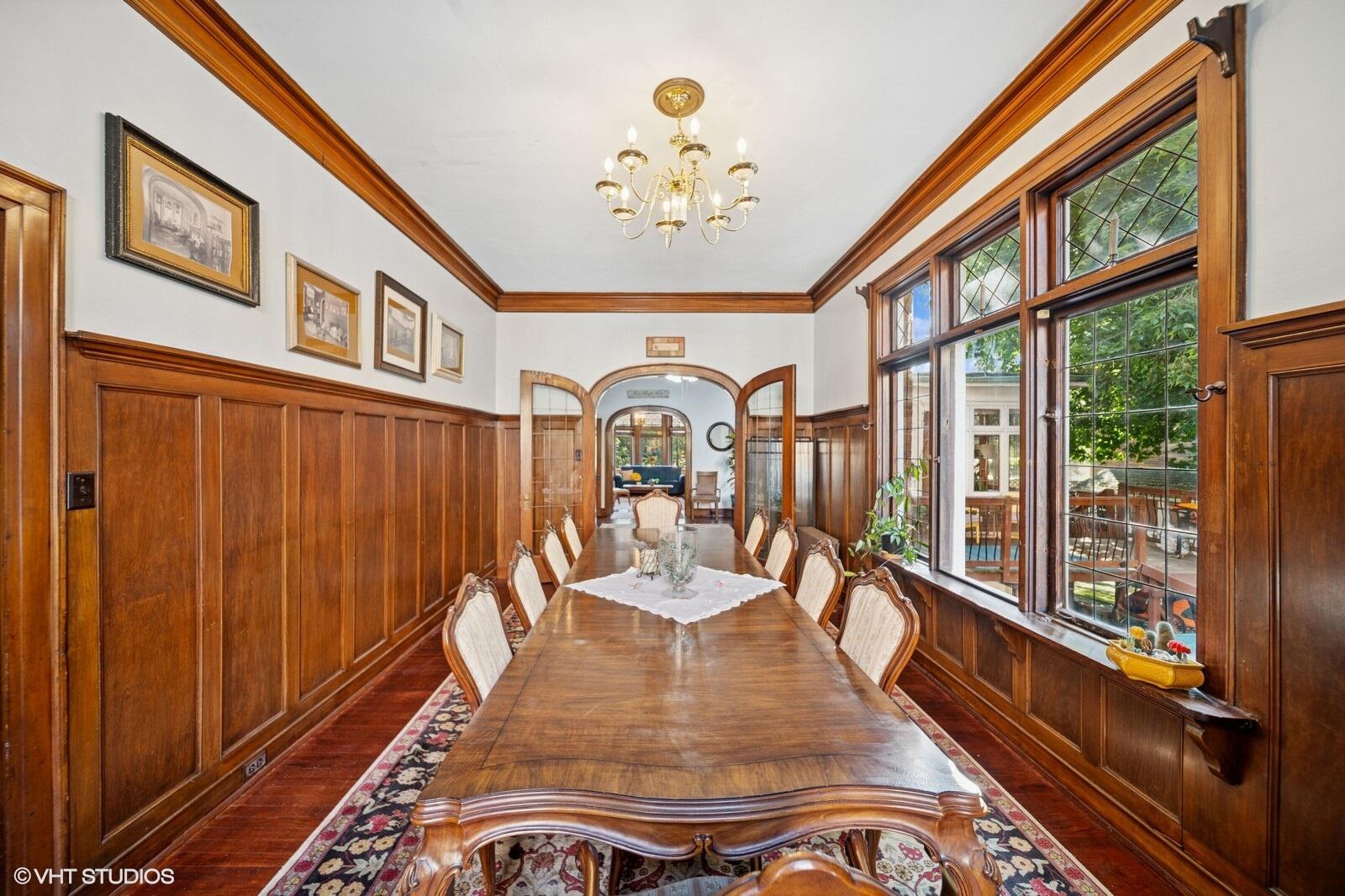 717 Pine Street Michigan City, IN 46360 - Photo 6 of 20 a view of a dining room with furniture a chandelier and wooden floor