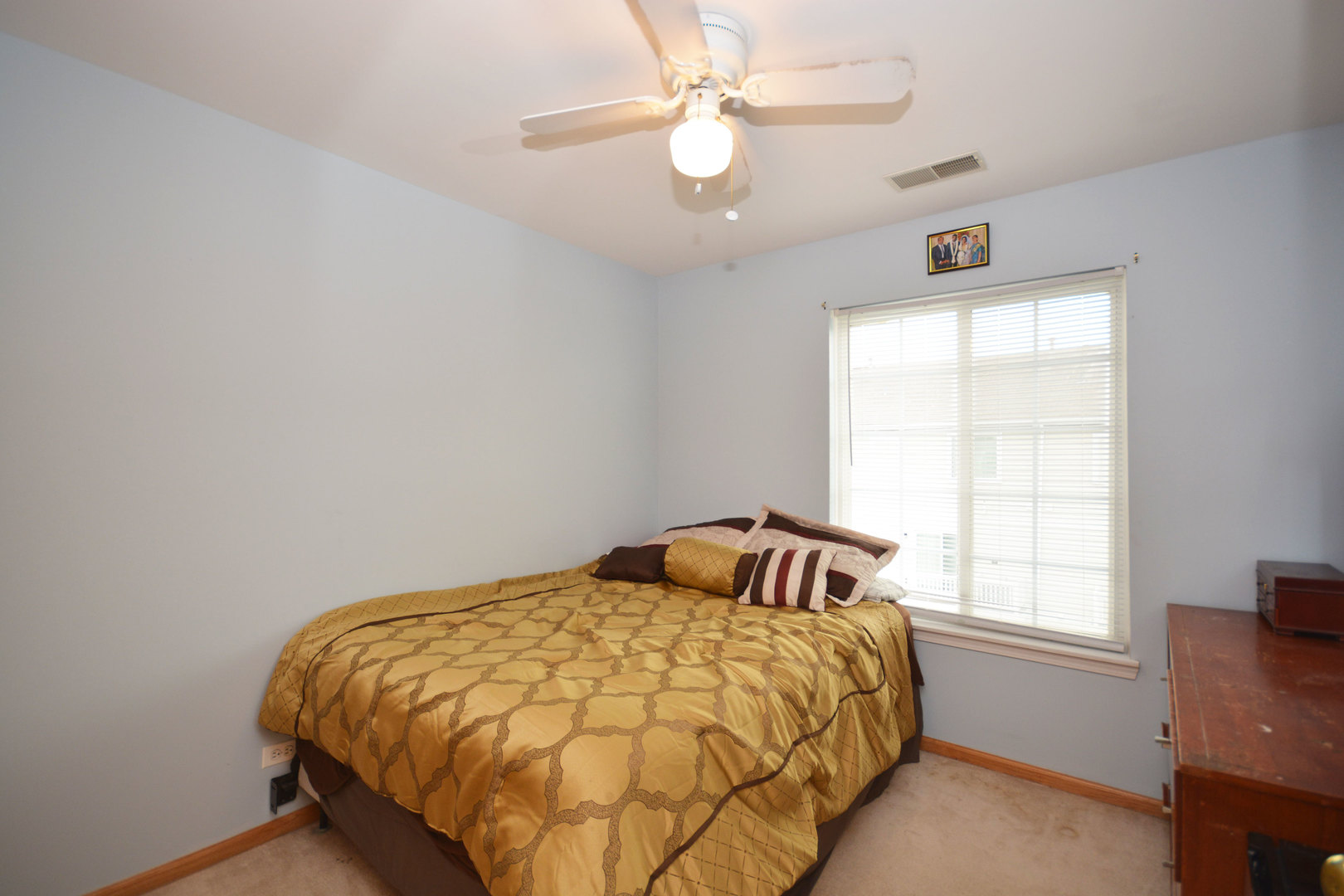 3450 Ravinia Circle Aurora, IL 60504 - Photo 11 of 13 a bedroom with a bed and window