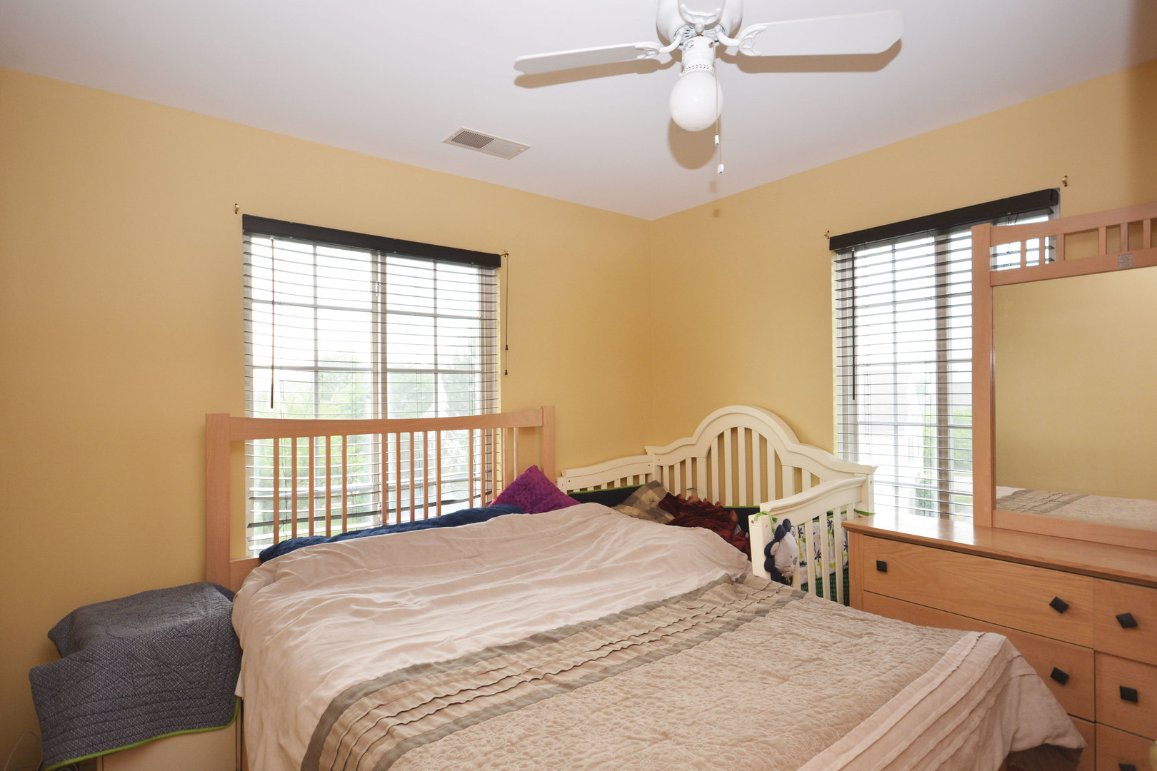 3450 Ravinia Circle Aurora, IL 60504 - Photo 12 of 13 a bedroom with a bed and a window