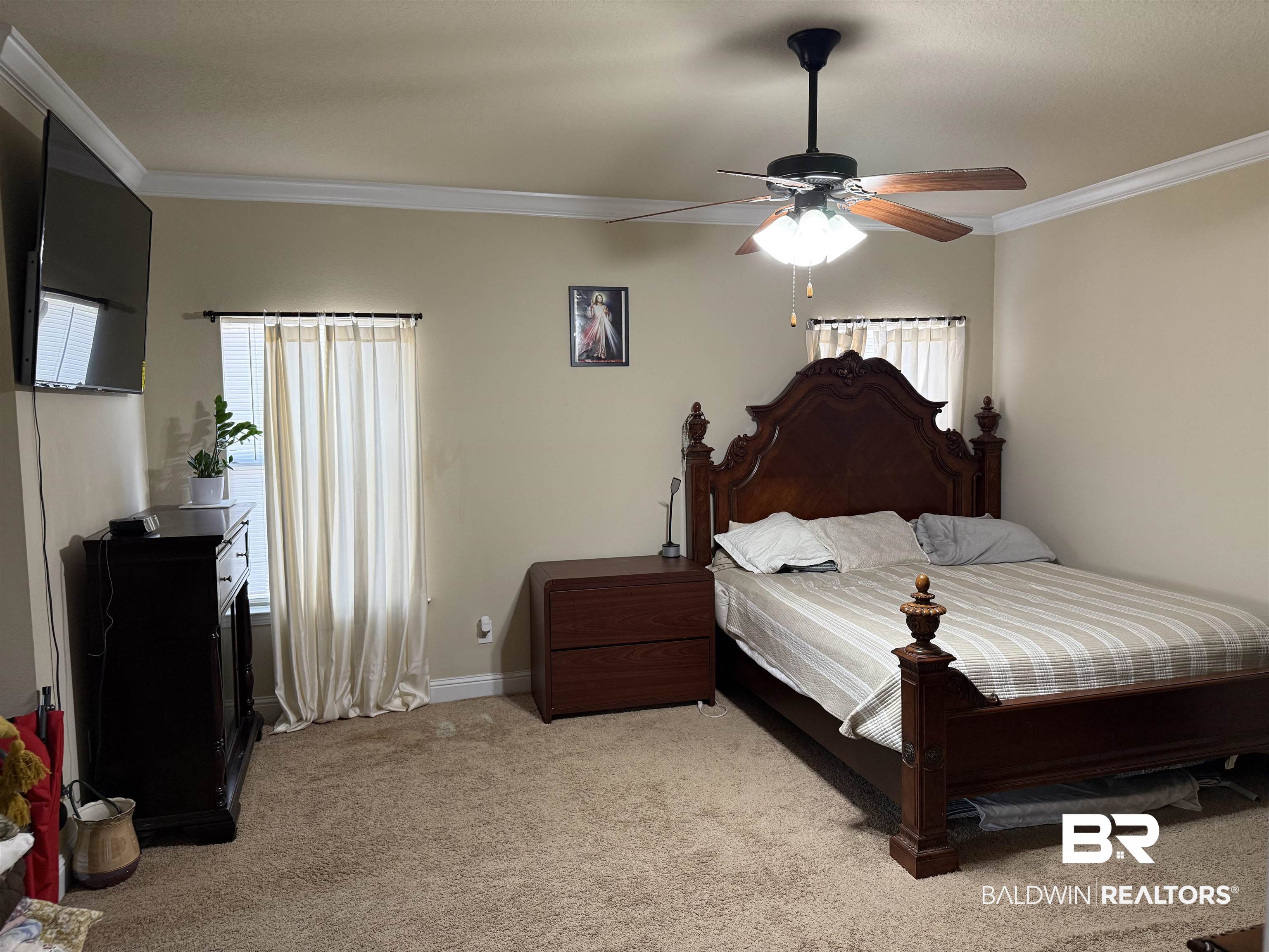 9023 Krystal Ridge Court Daphne, AL 36526 - Photo 19 of 41 Bedroom with light colored carpet, crown molding, ceiling fan, and multiple windows