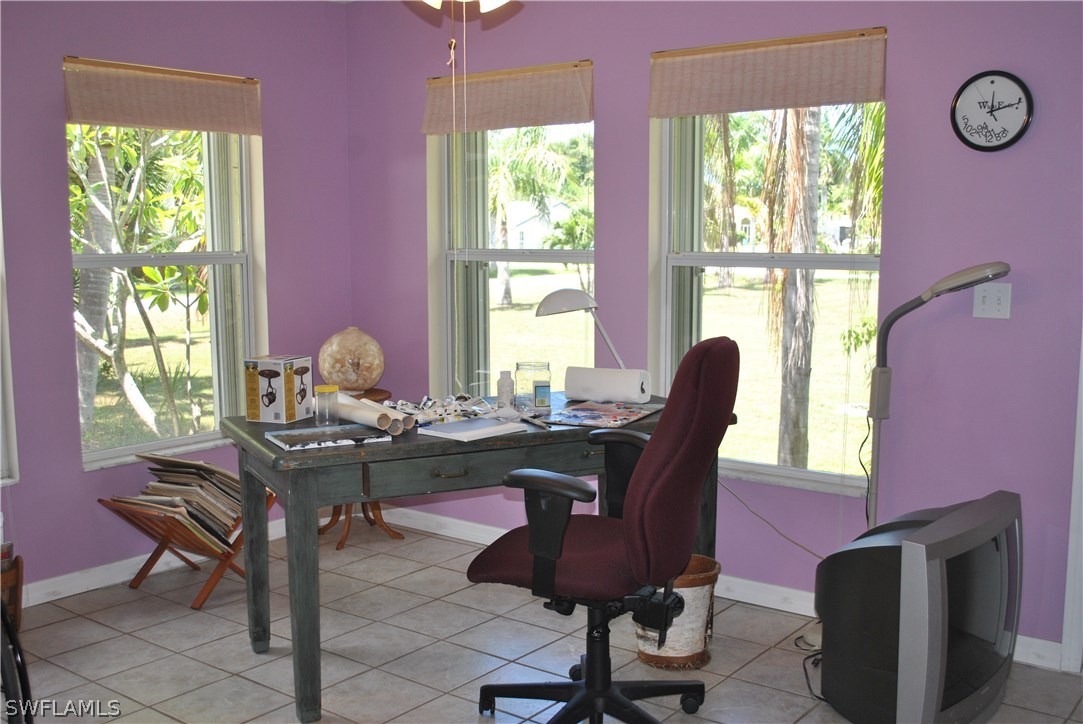 5824 Mackerel Road Bokeelia, FL 33922 - Photo 12 of 25 a workspace with furniture and a window