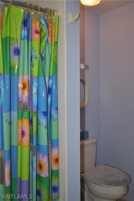5824 Mackerel Road Bokeelia, FL 33922 - Photo 23 of 25 a bathroom with a toilet and sink