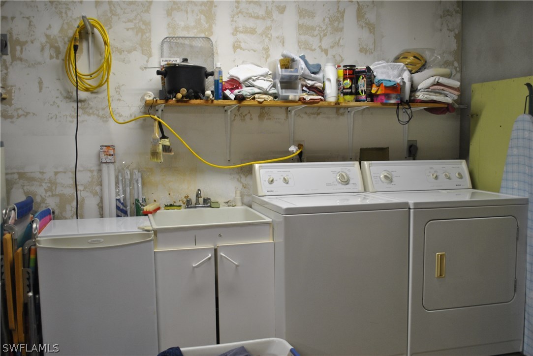 5824 Mackerel Road Bokeelia, FL 33922 - Photo 24 of 25 a utility room with dryer and washer