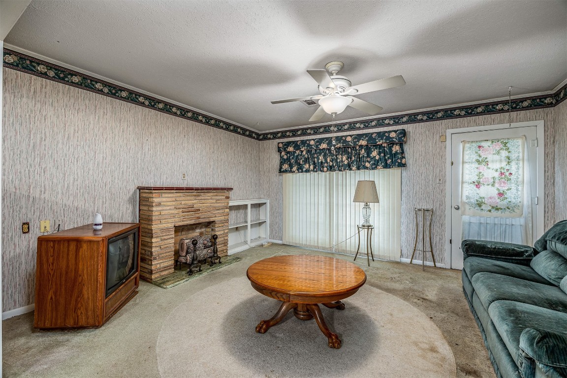 718 Nelson Street Crosby, TX 77532 - Photo 14 of 38 a living room with furniture and a chandelier