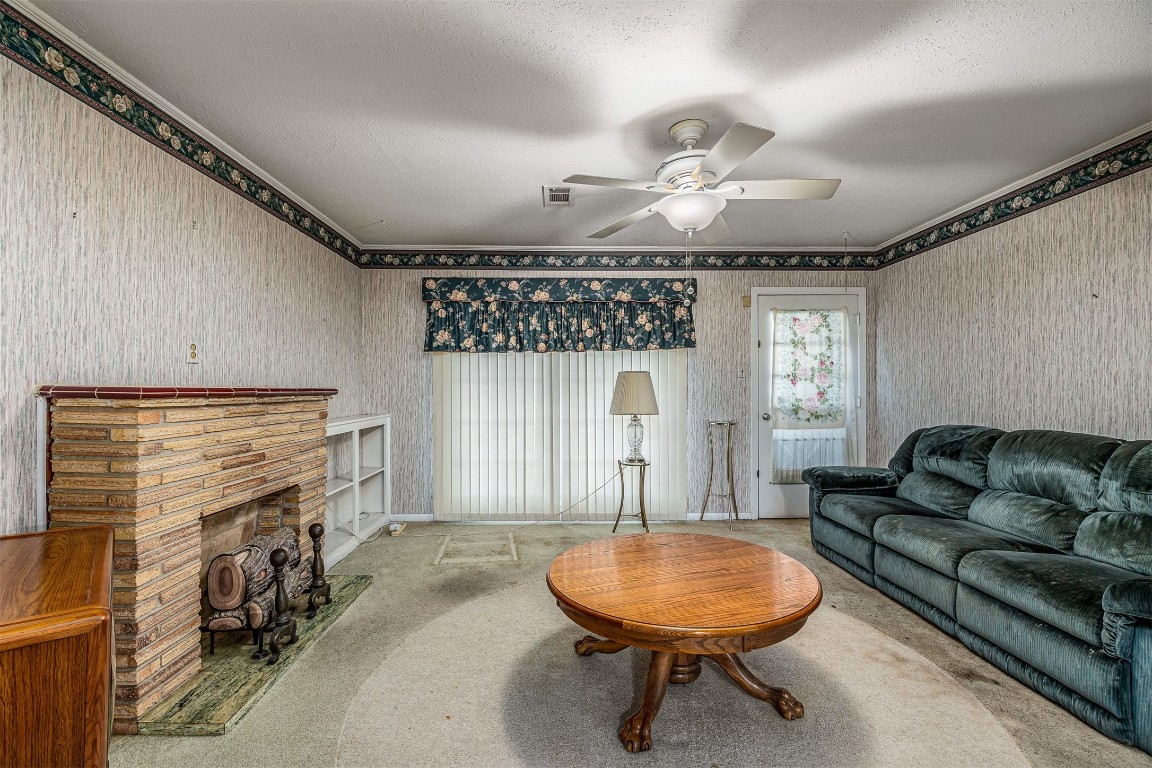 718 Nelson Street Crosby, TX 77532 - Photo 15 of 38 a living room with furniture a fireplace and a large window