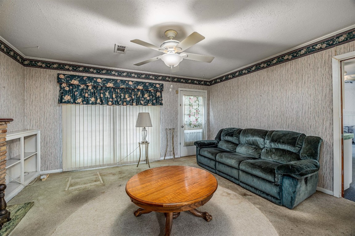 718 Nelson Street Crosby, TX 77532 - Photo 16 of 38 a living room with furniture a chandelier and a window