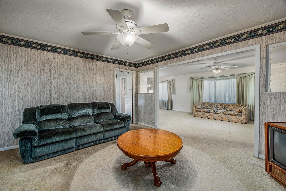 718 Nelson Street Crosby, TX 77532 - Photo 17 of 38 a living room with furniture and a chandelier