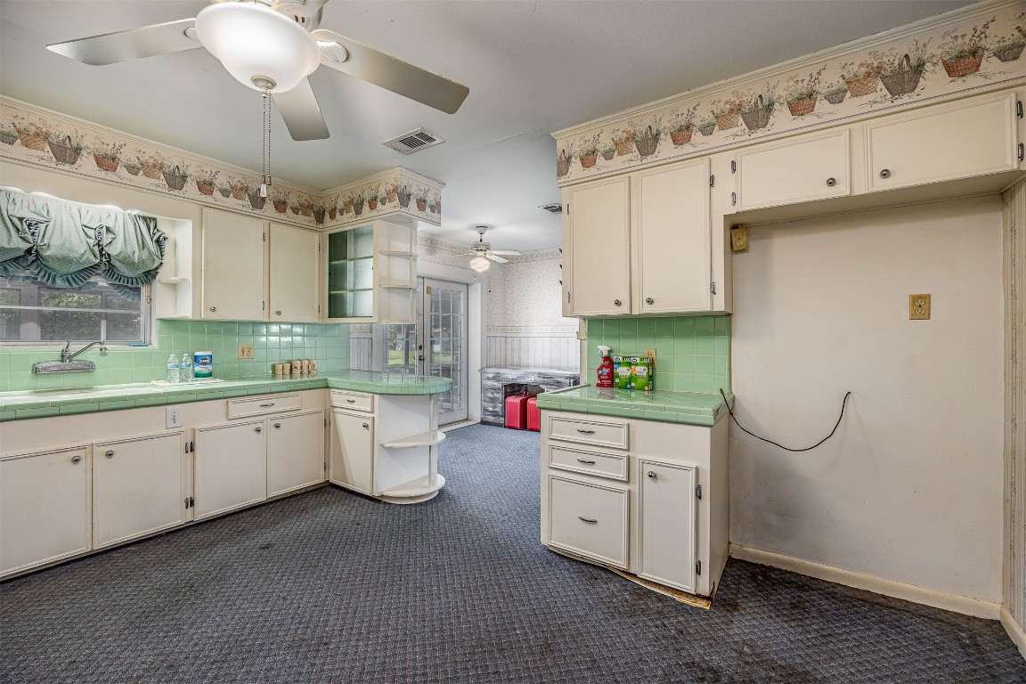 718 Nelson Street Crosby, TX 77532 - Photo 19 of 38 a kitchen with sink cabinets and window