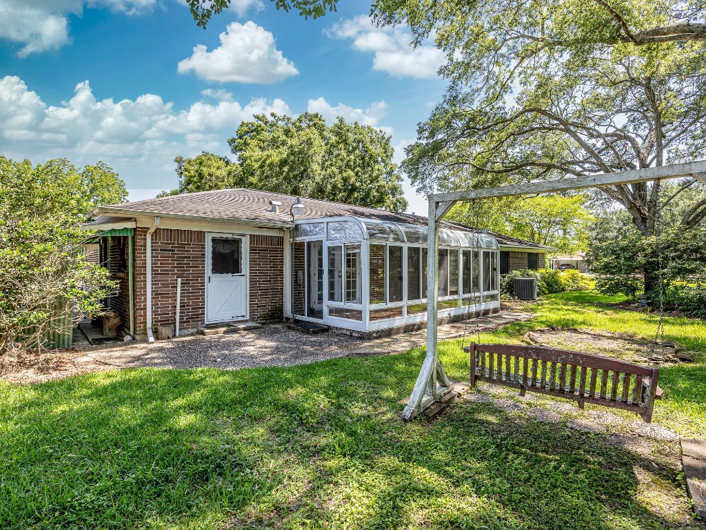 718 Nelson Street Crosby, TX 77532 - Photo 33 of 38 a view of a house with a yard and sitting area