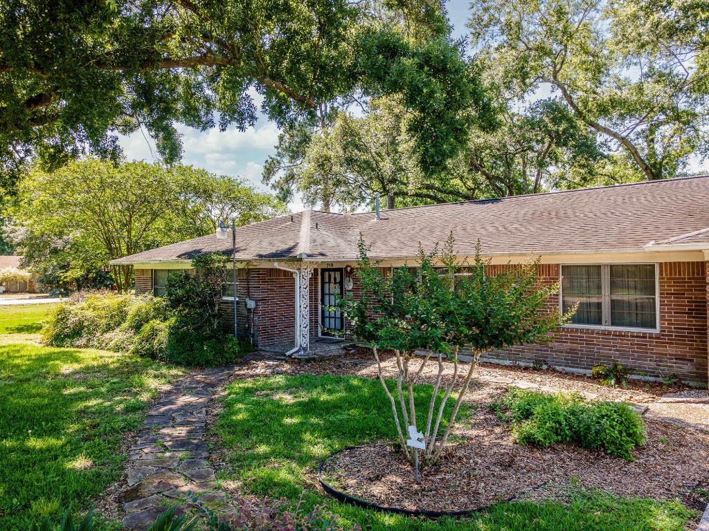 718 Nelson Street Crosby, TX 77532 - Photo 35 of 38 a view of an house with backyard space and garden