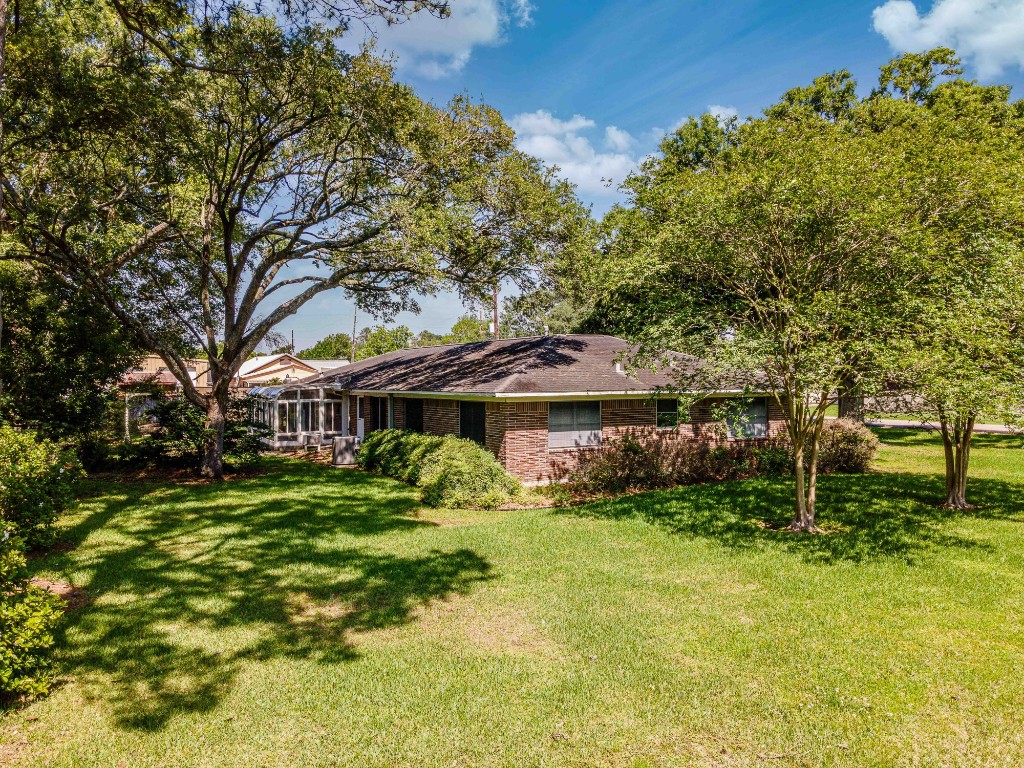 718 Nelson Street Crosby, TX 77532 - Photo 5 of 38 a front view of a house with a yard
