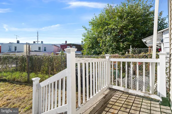 a view of a balcony with wooden floor