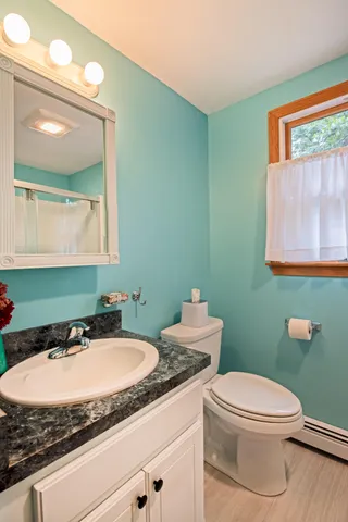 a bathroom with a glass shower door