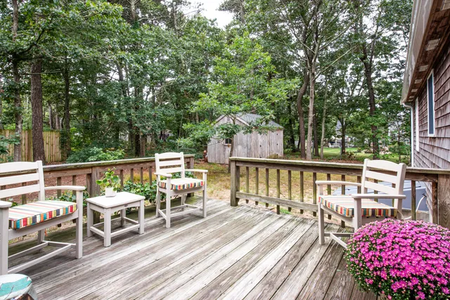 a view of deck with wooden floor and seating space