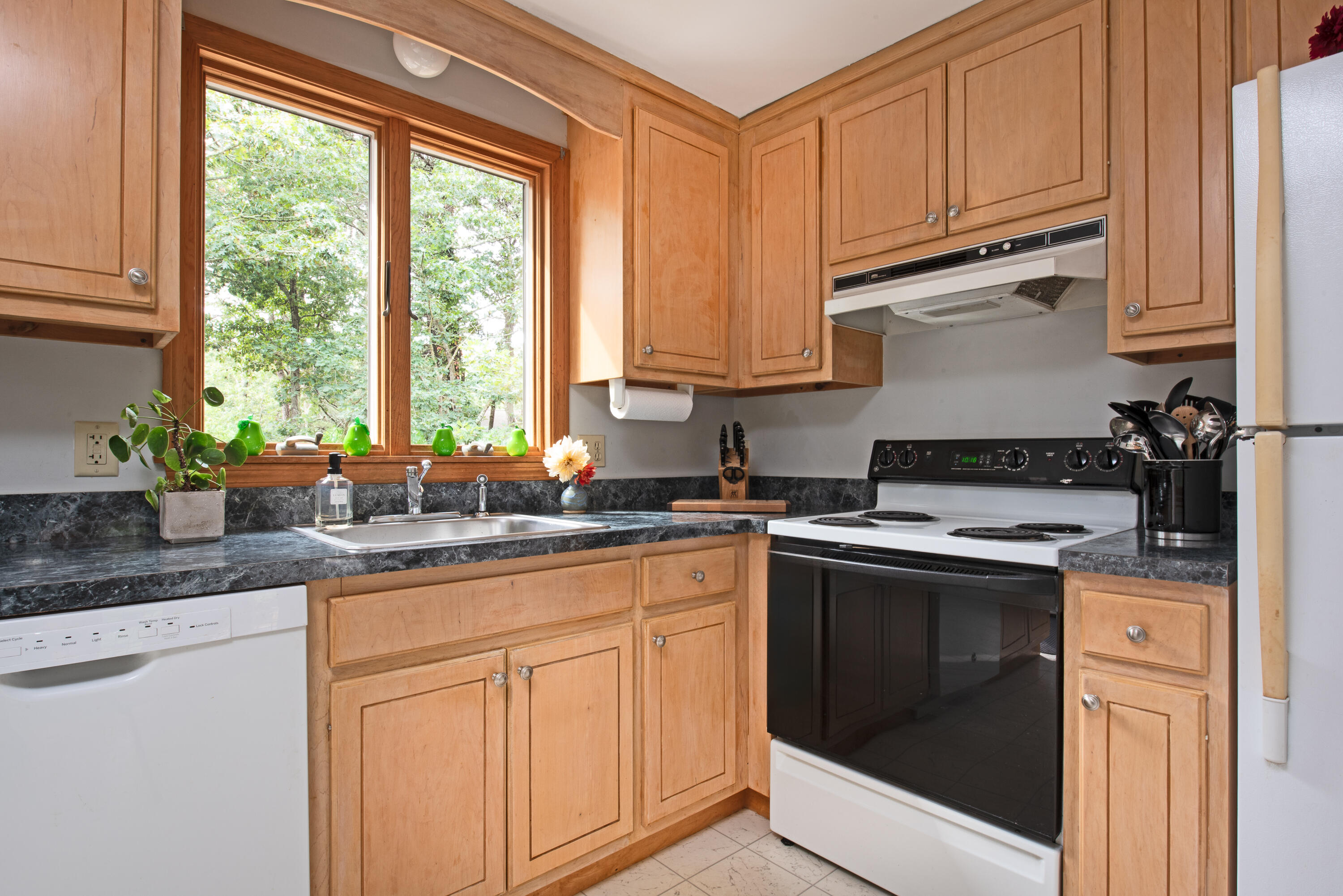 100 Gigi Lane Eastham, MA 02642 - Photo 7 of 30 a kitchen with stainless steel appliances granite countertop a sink stove and cabinets