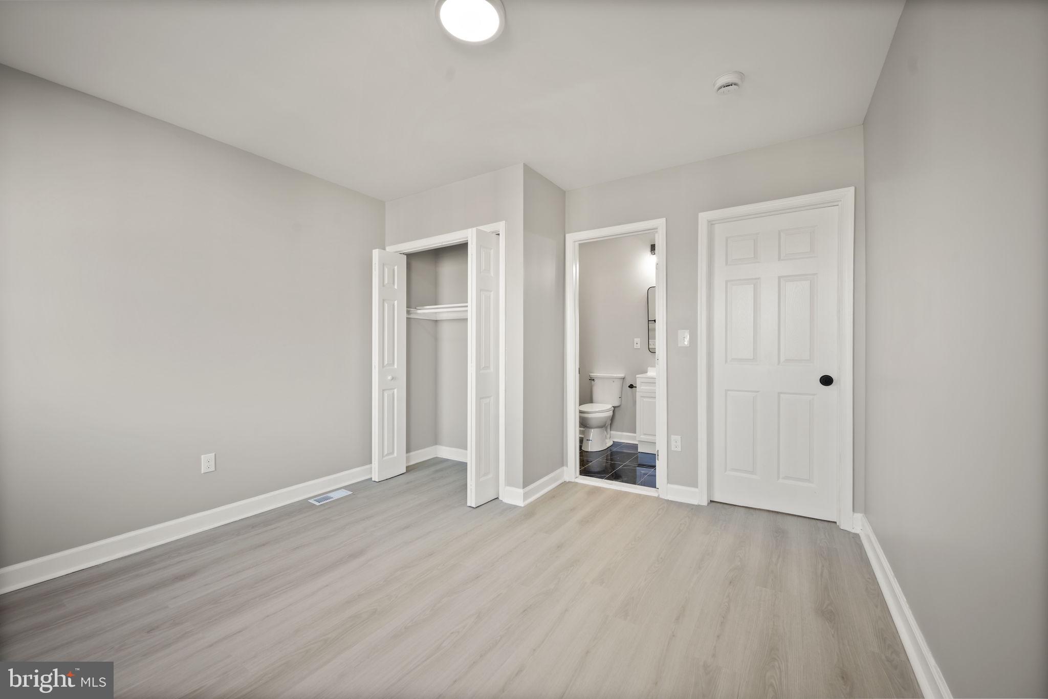 217 North Port Street Baltimore, MD 21224 - Photo 13 of 31 a view of an empty room with wooden floor