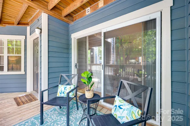 a view of front door of house with wooden floor