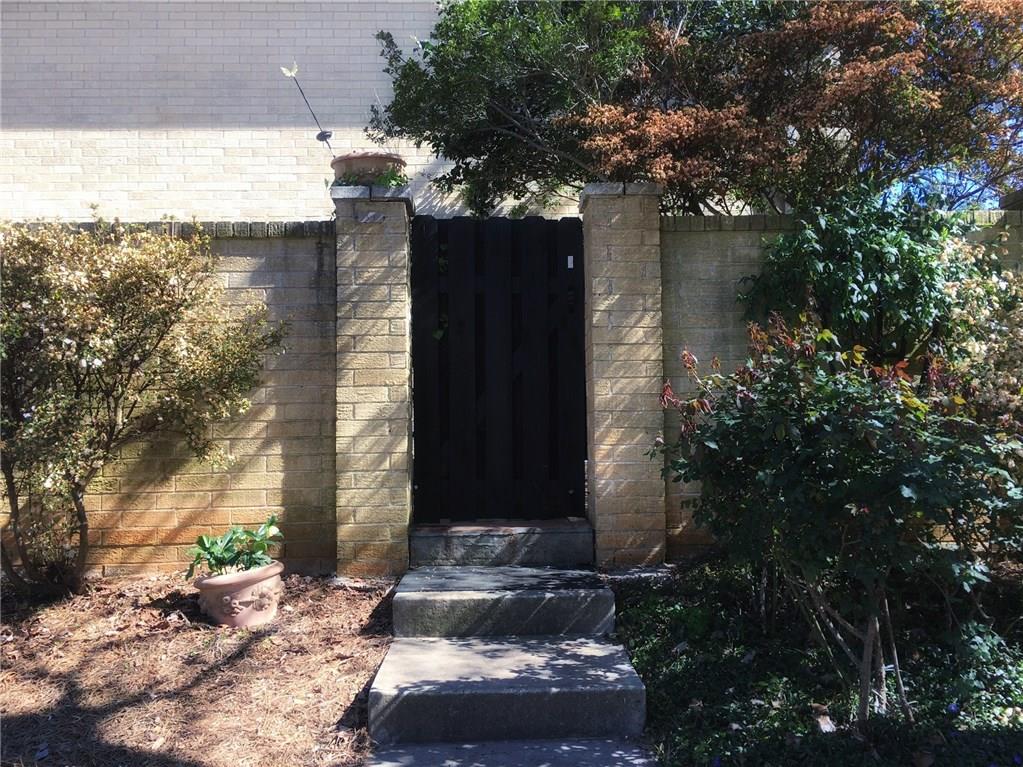 5400 Roswell Road, Unit A1 Atlanta, GA 30342 - Photo 1 of 1 Private entrance, beautifully landscaped with lots of roses and azaleas