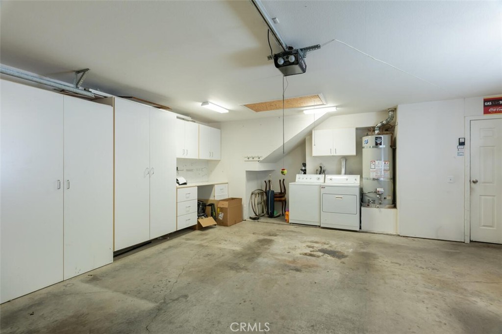 1718 Tecalote Drive, Unit 9 Fallbrook, CA 92028 - Photo 20 of 23 2 Car Garage cabinets - workbench and attic storage